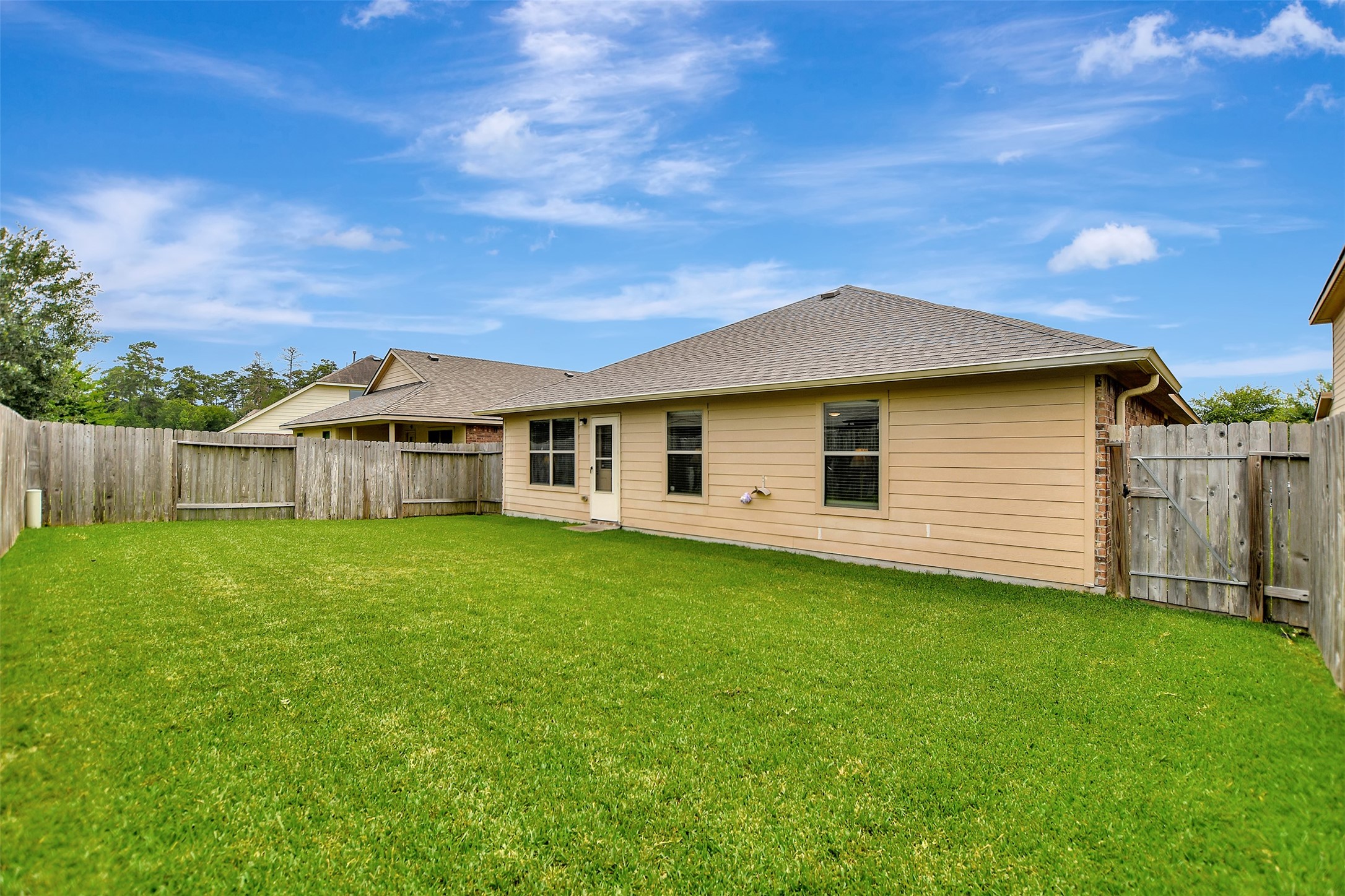 23314 Sawmill Pass Spring, TX 77373 - Photo 38 of 41 a view of a backyard with a garden