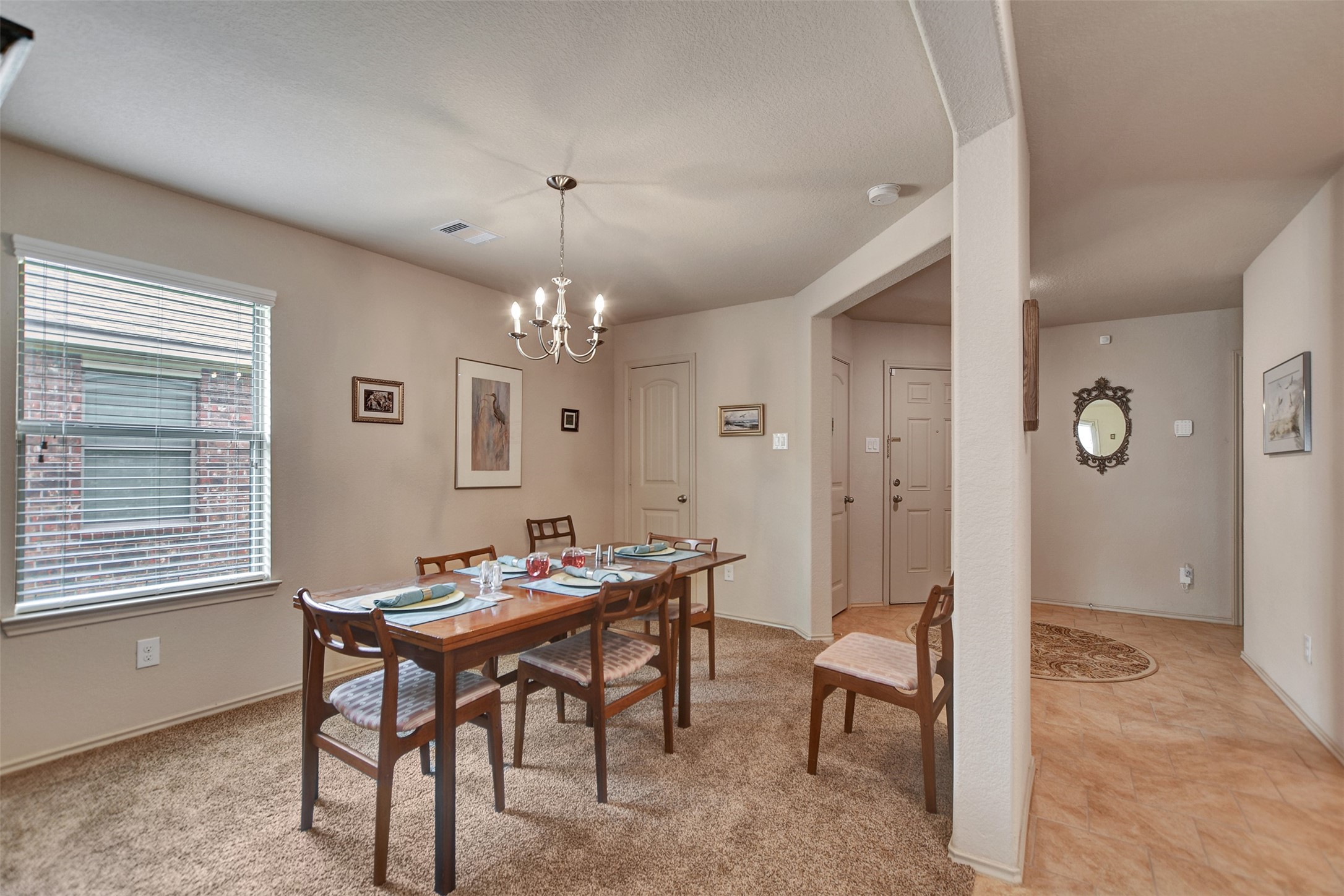 23314 Sawmill Pass Spring, TX 77373 - Photo 8 of 41 a view of a dining room with furniture and chandelier
