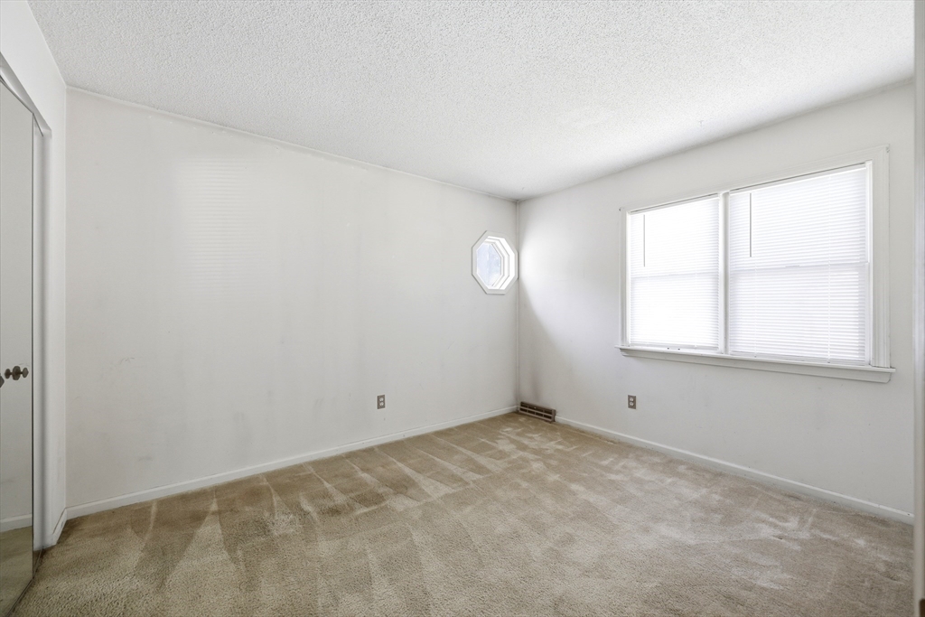 19-21 Wedgewood Circle Springfield, MA 01129 - Photo 14 of 32 an empty room with a window