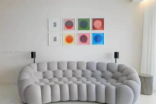 a bathroom with a baby crib and a couch