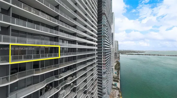 a view of a large building with a big yard and a large window