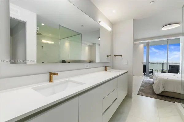 a spacious bathroom with a double vanity sink mirror and