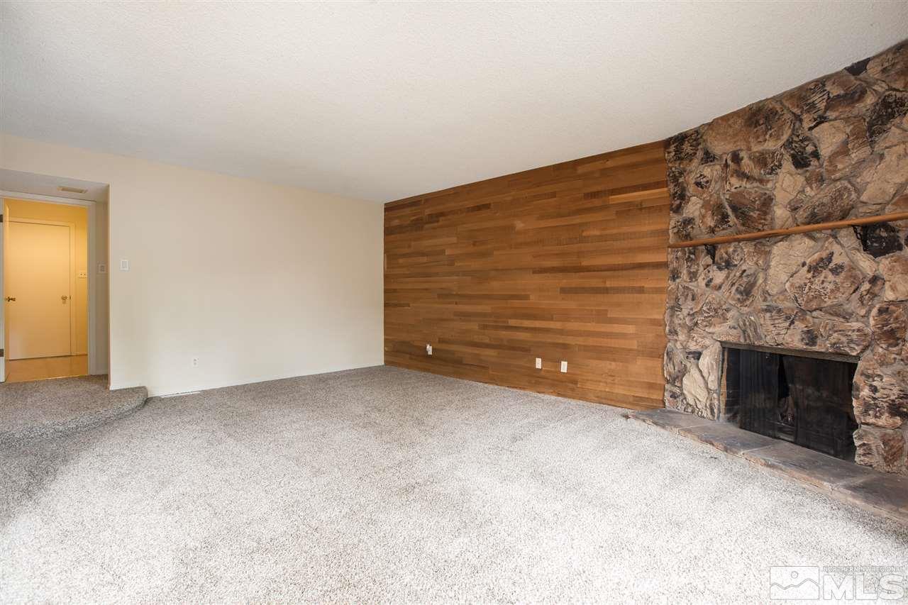 885 Twin Pines Road Reno, NV 89509 - Photo 11 of 25 a view of an empty room with a fireplace