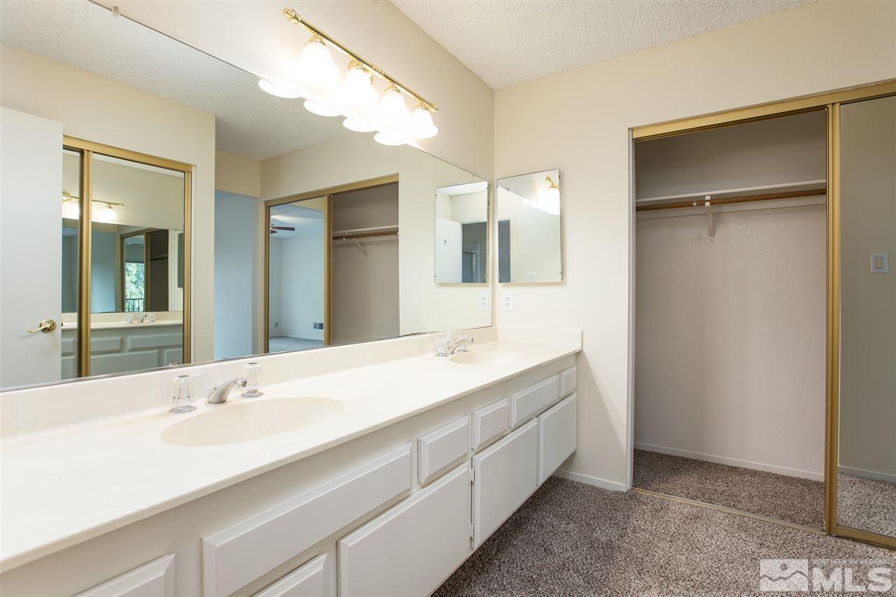 885 Twin Pines Road Reno, NV 89509 - Photo 15 of 25 a bathroom with a double vanity sink and mirror
