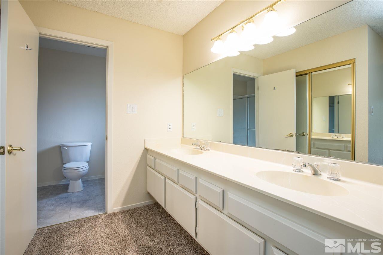 885 Twin Pines Road Reno, NV 89509 - Photo 16 of 25 a spacious bathroom with a sink and a mirror