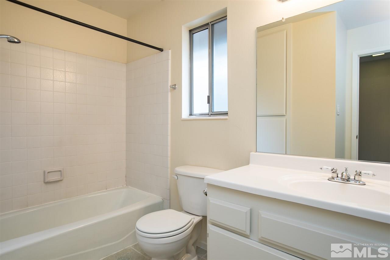 885 Twin Pines Road Reno, NV 89509 - Photo 19 of 25 a bathroom with a sink a toilet and shower