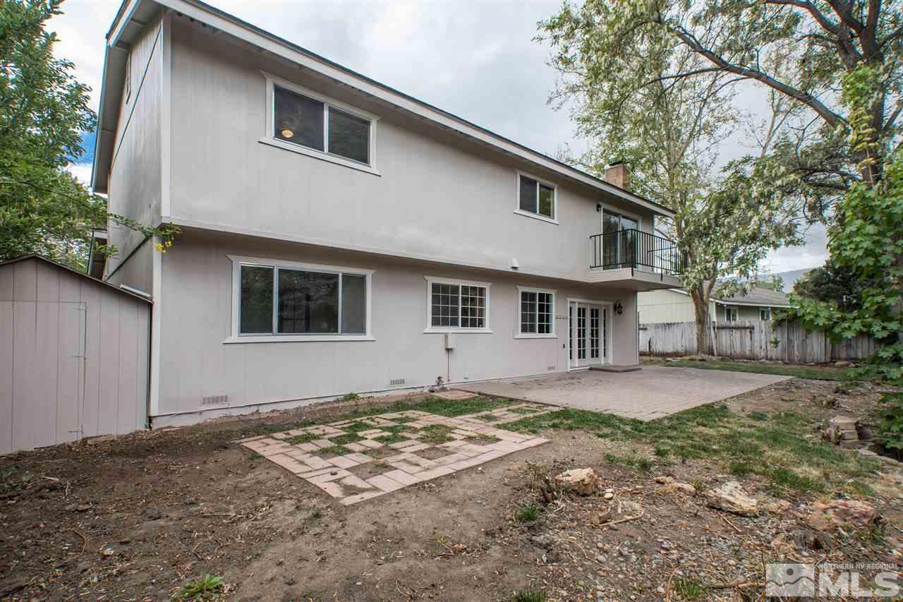 885 Twin Pines Road Reno, NV 89509 - Photo 22 of 25 a front view of a house with a yard