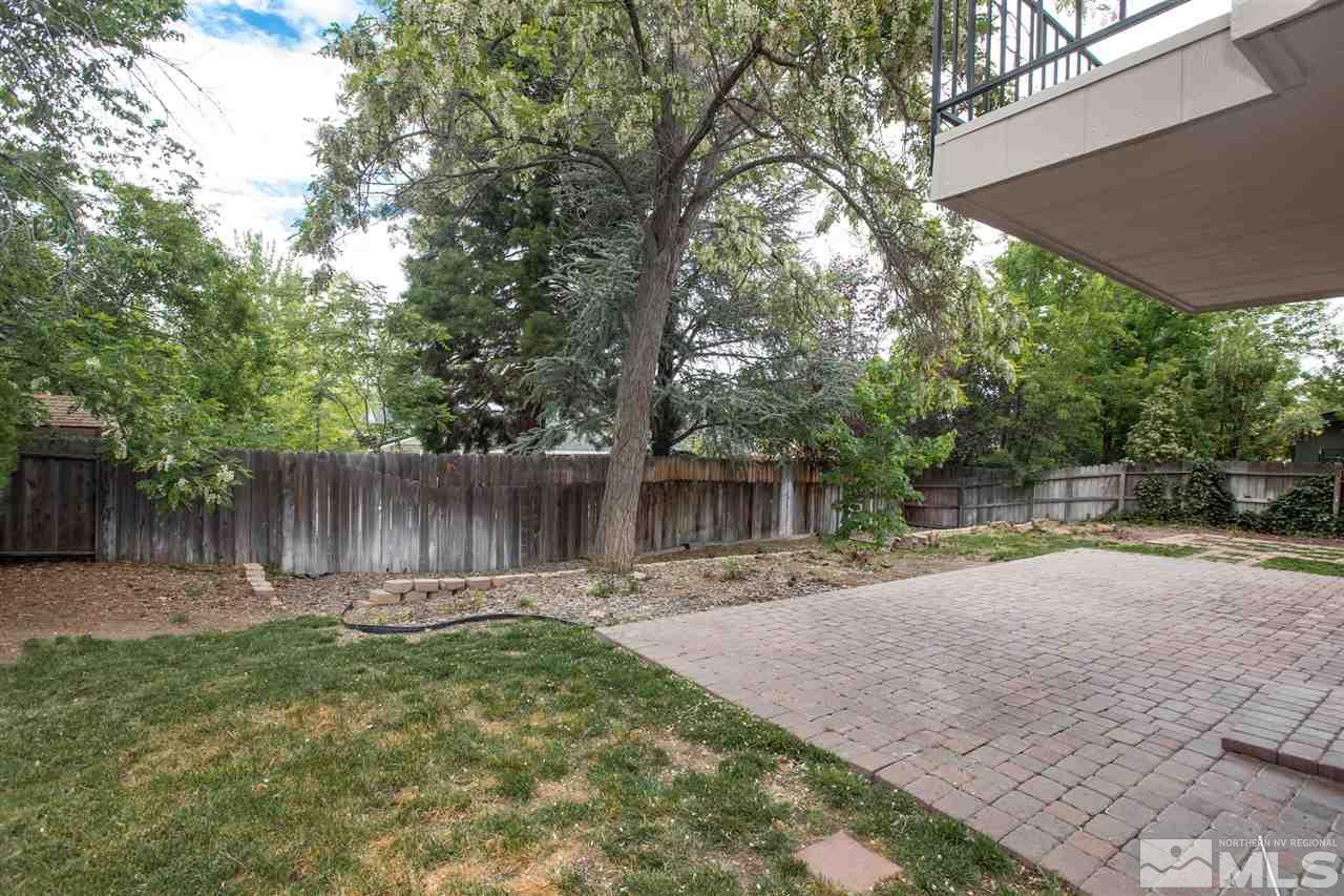 885 Twin Pines Road Reno, NV 89509 - Photo 24 of 25 a backyard of a house with table and chairs