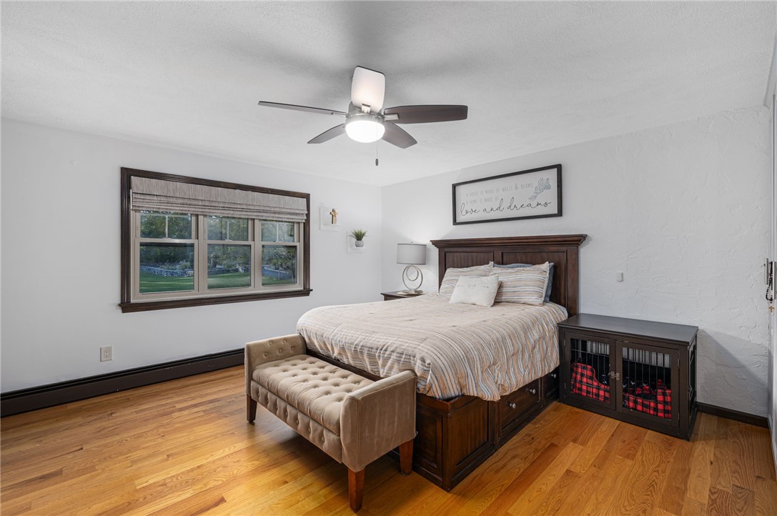 365 West Wrentham Road Cumberland, RI 02864 - Photo 26 of 50 Nicely sized primary bedroom with hardwoods and triple window
