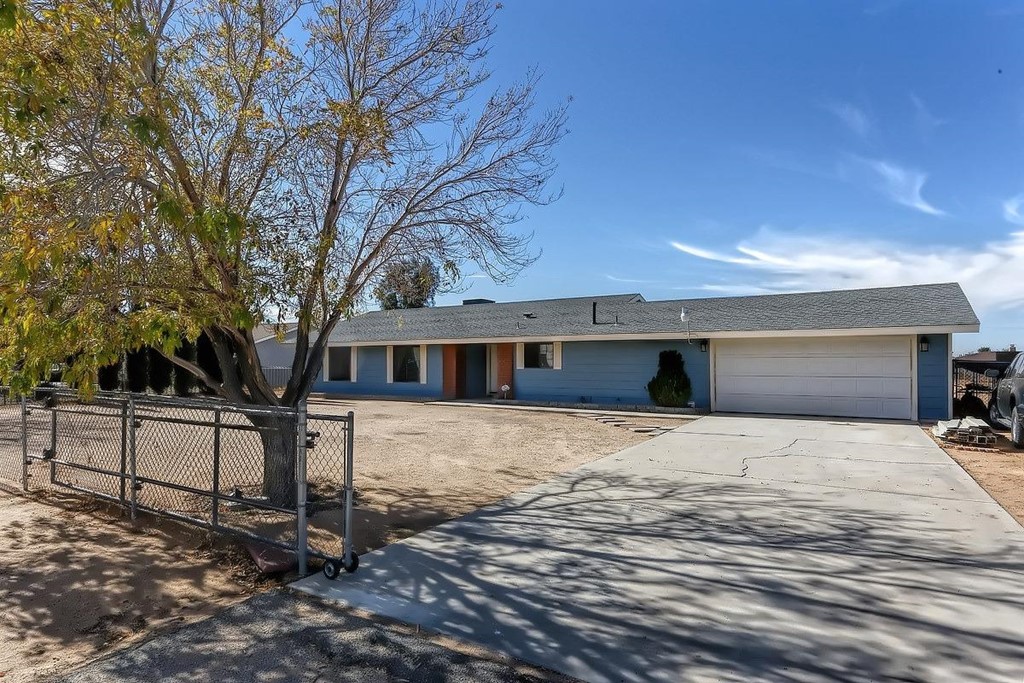 11820 Pasco Road Apple Valley, CA 92308 - Photo 1 of 1 a front view of a house with a yard