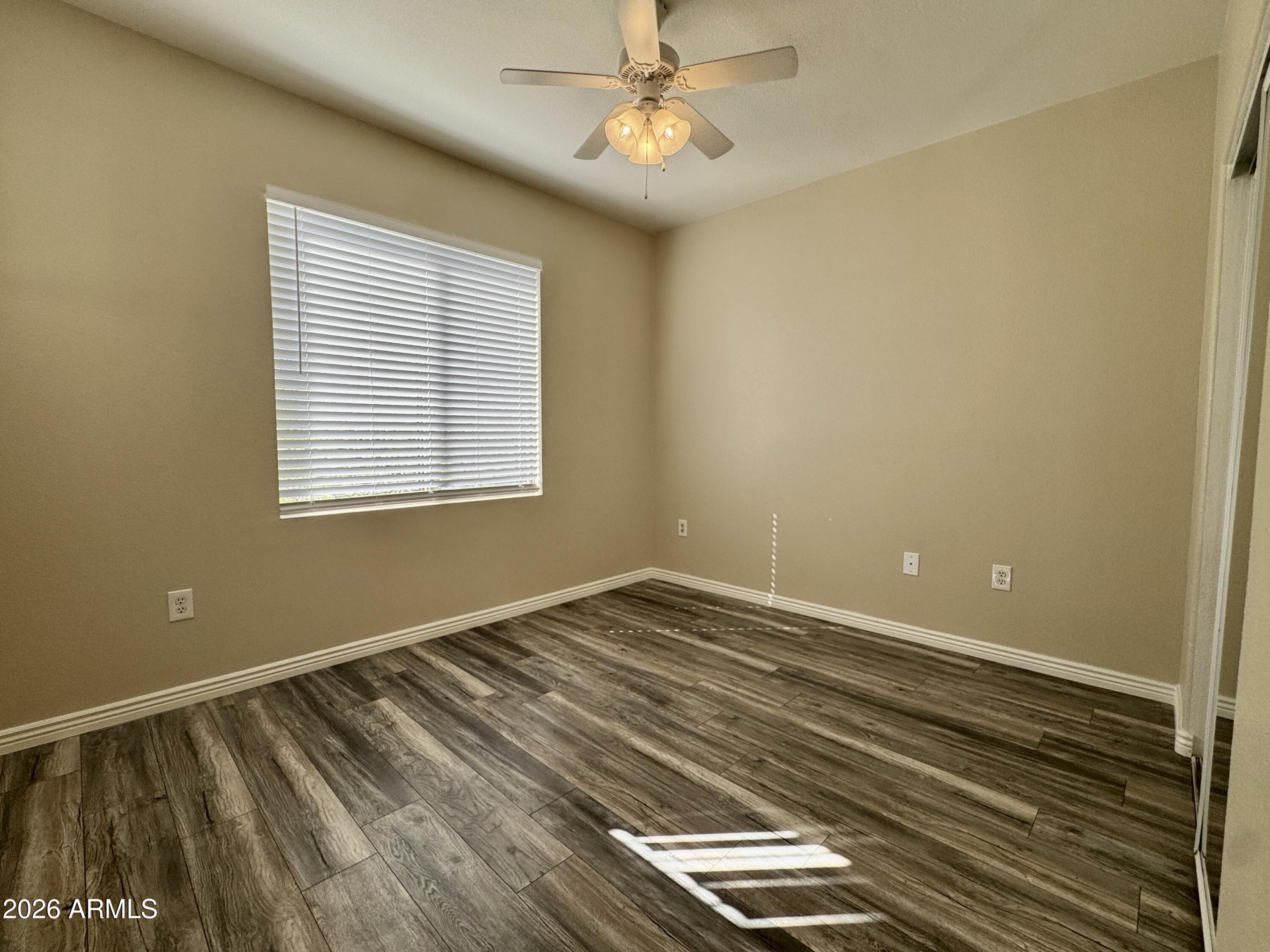 18416 North Cave Creek Road, Unit 2033 Phoenix, AZ 85032 - Photo 8 of 18 a view of room with window and ceiling fan