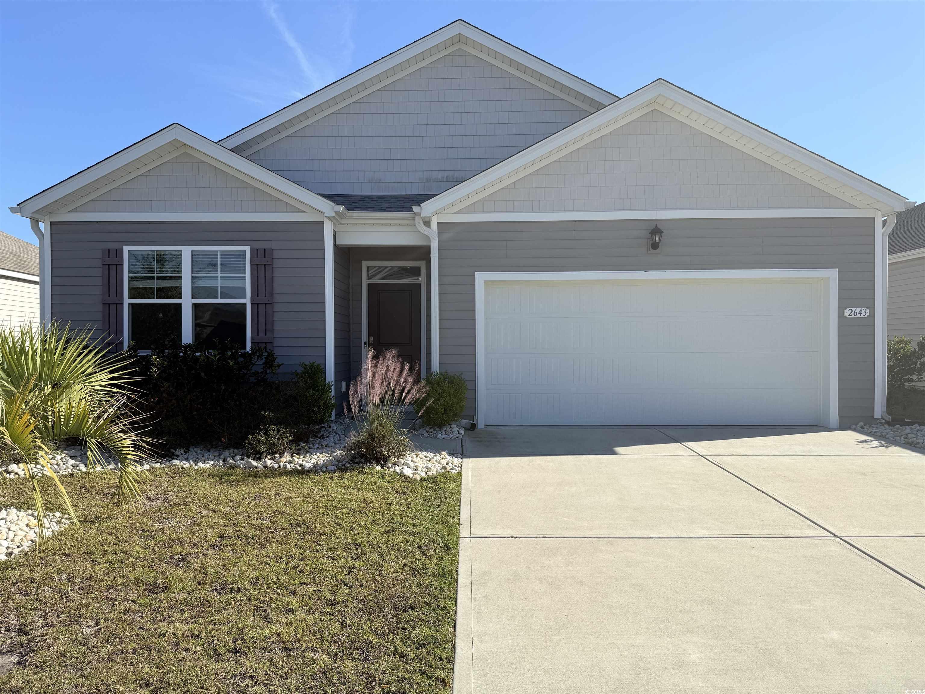 2643 Ophelia Way Myrtle Beach, SC 29577 - Photo 1 of 40 View of front of property with a garage, concrete driveway, and a front lawn