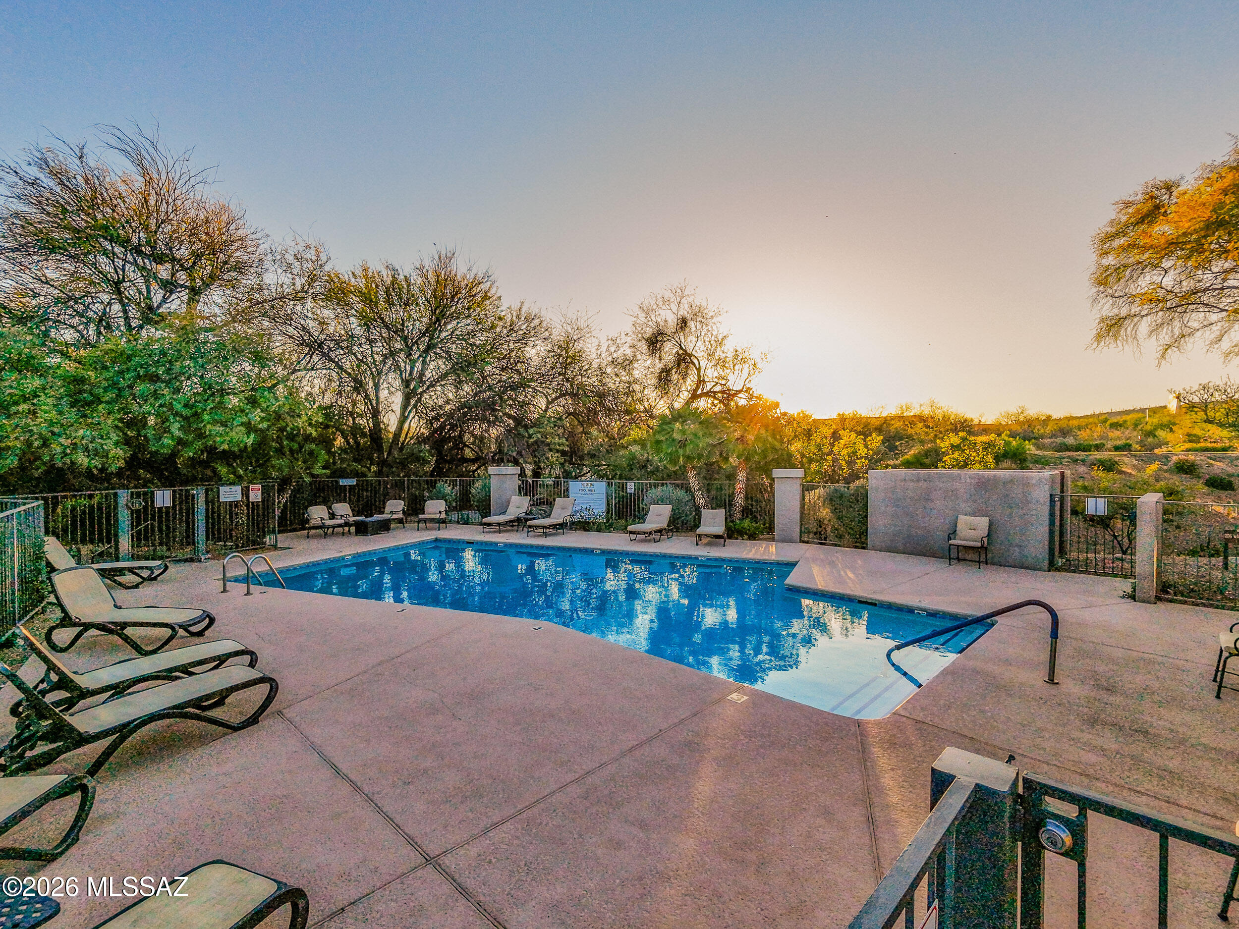 5855 North Kolb Road, Unit 6103 Tucson, AZ 85750 - Photo 23 of 31 a view of a swimming pool with a lounge chair