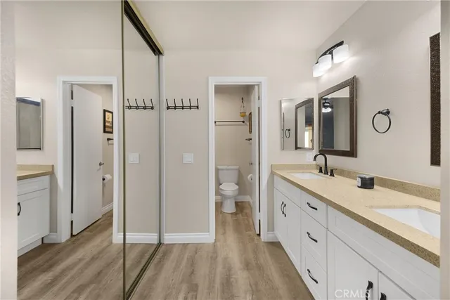 a spacious bathroom with a double vanity sink and a mirror