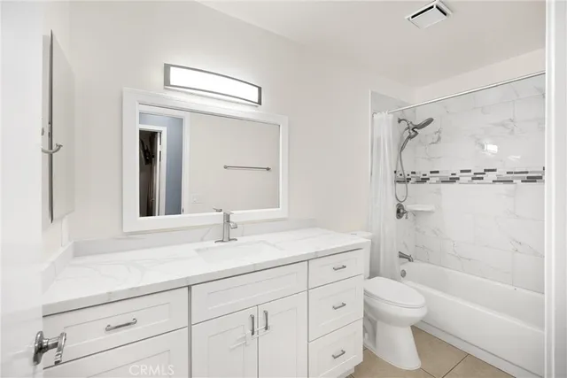 a bathroom with a sink a toilet and a bathtub