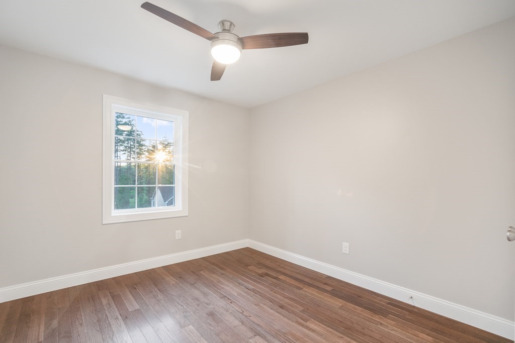 241 Glendale Road Northampton, MA 01062 - Photo 16 of 29 an empty room with wooden floor fan and windows