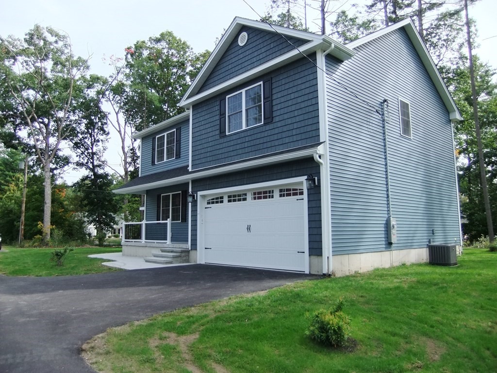 241 Glendale Road Northampton, MA 01062 - Photo 3 of 29 a front view of a house with a yard