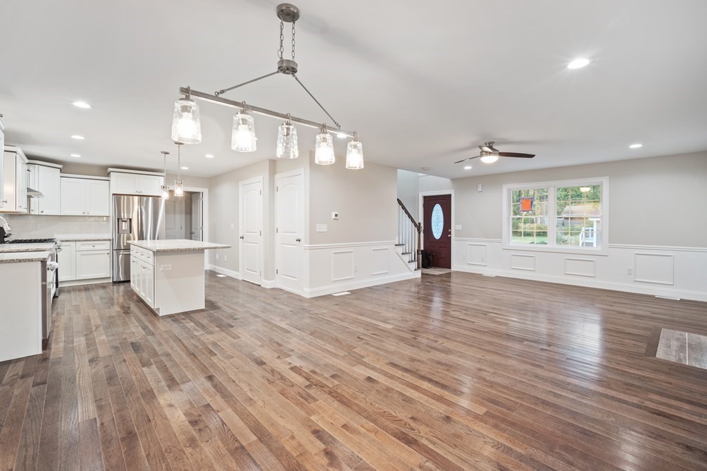 241 Glendale Road Northampton, MA 01062 - Photo 7 of 29 an empty room with wooden floor and windows