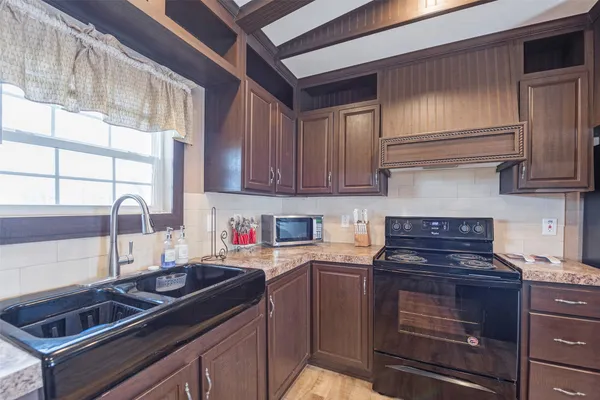 a kitchen with a stove and a sink