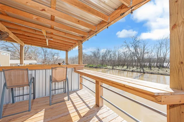 a view of a room with wooden floor and iron fence