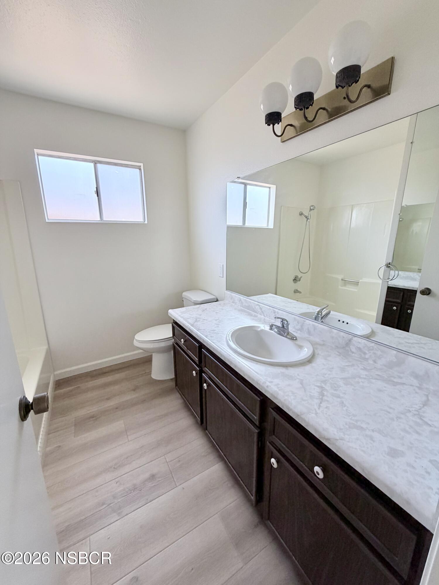 181 Janet Avenue Grover Beach, CA 93433 - Photo 12 of 21 a bathroom with a sink and a mirror