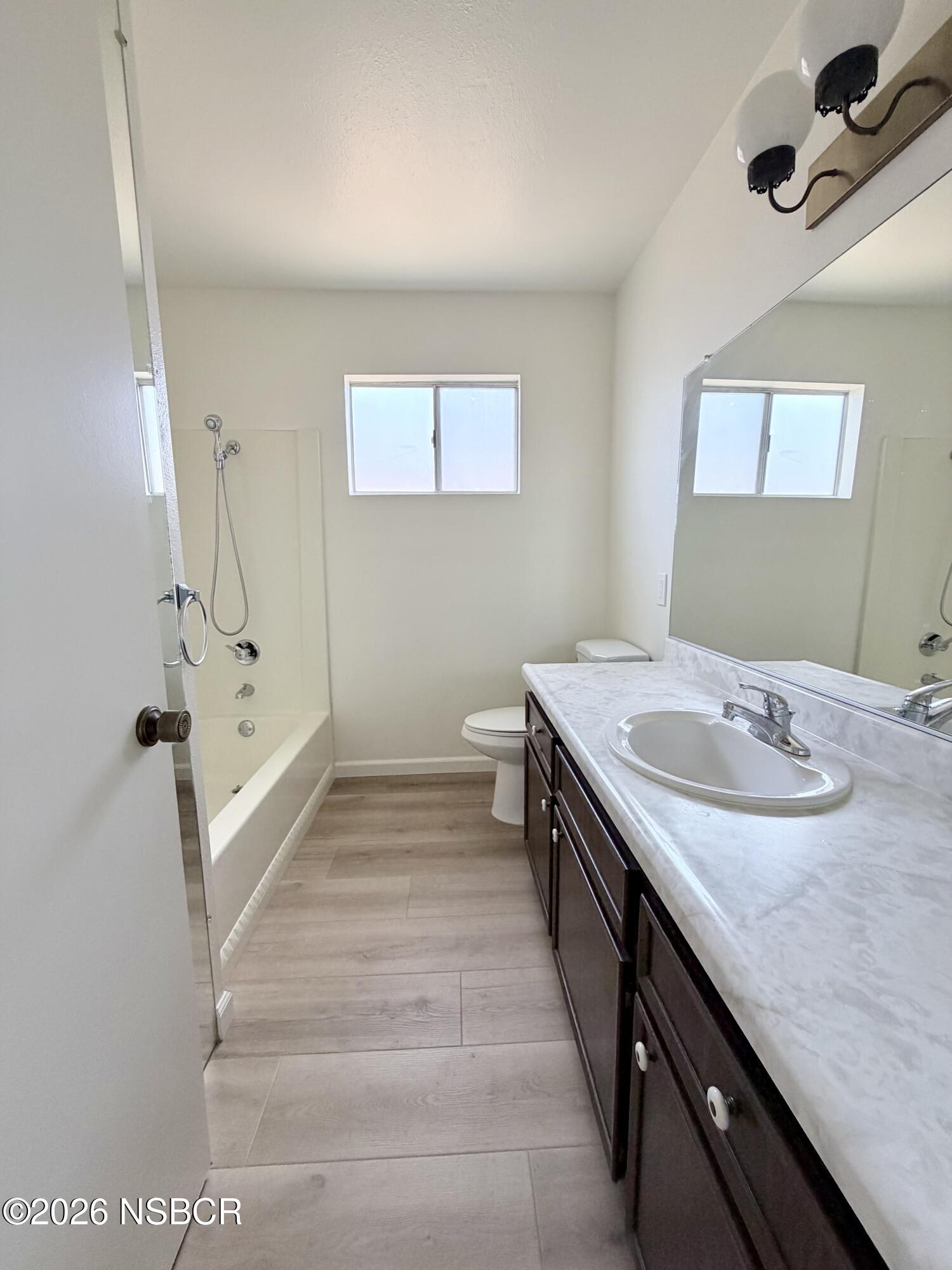 181 Janet Avenue Grover Beach, CA 93433 - Photo 13 of 21 a bathroom with a sink and a mirror
