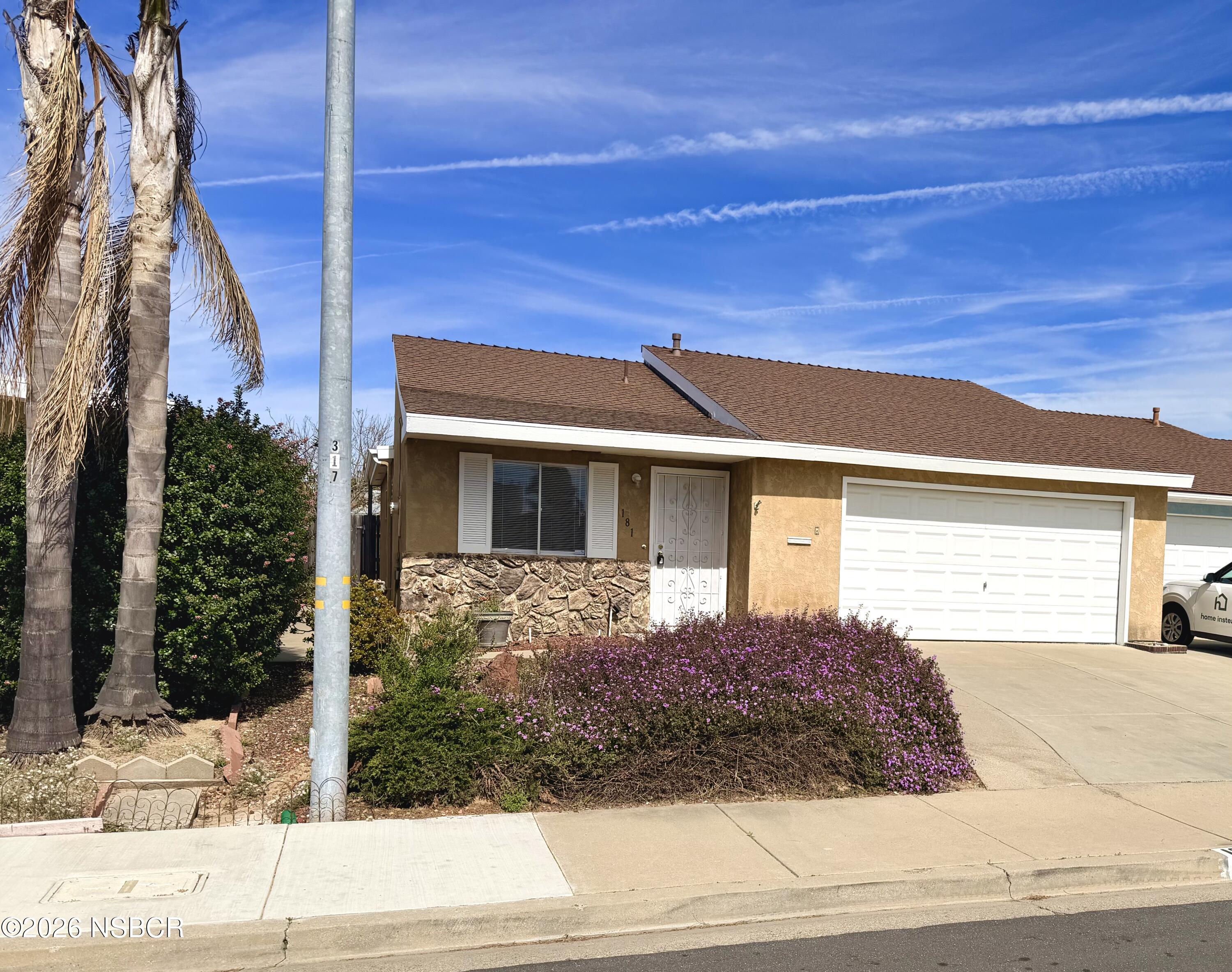 181 Janet Avenue Grover Beach, CA 93433 - Photo 2 of 21 a view of a house with a yard