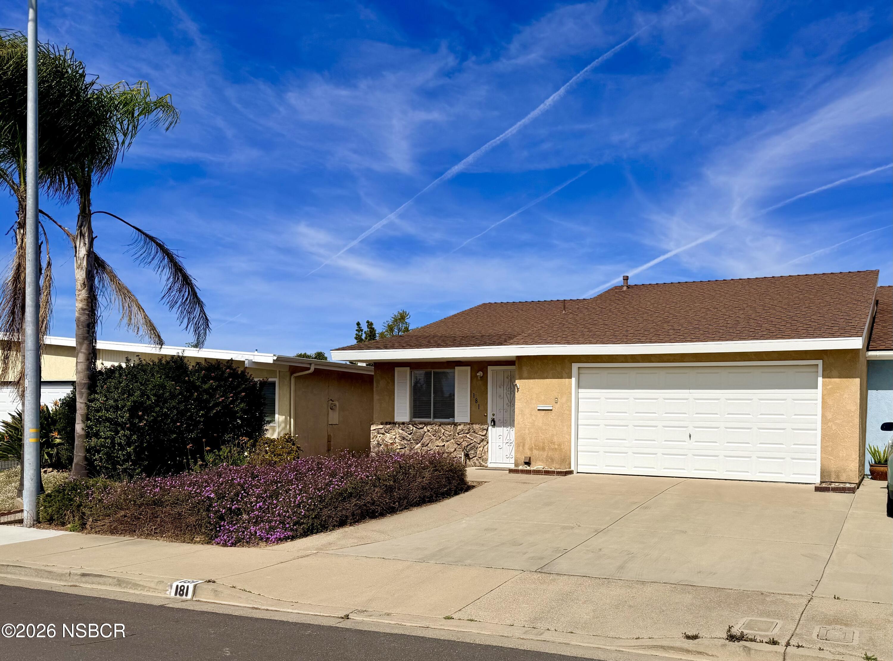 181 Janet Avenue Grover Beach, CA 93433 - Photo 3 of 21 a front view of a house with garden