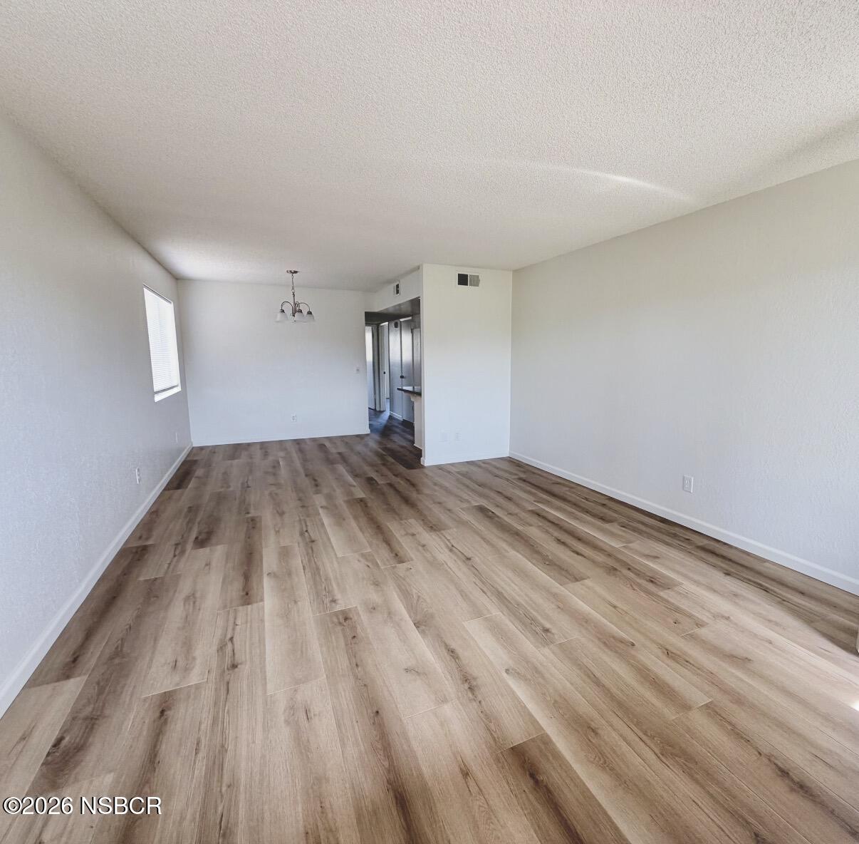 181 Janet Avenue Grover Beach, CA 93433 - Photo 5 of 21 a view of empty room with wooden floor
