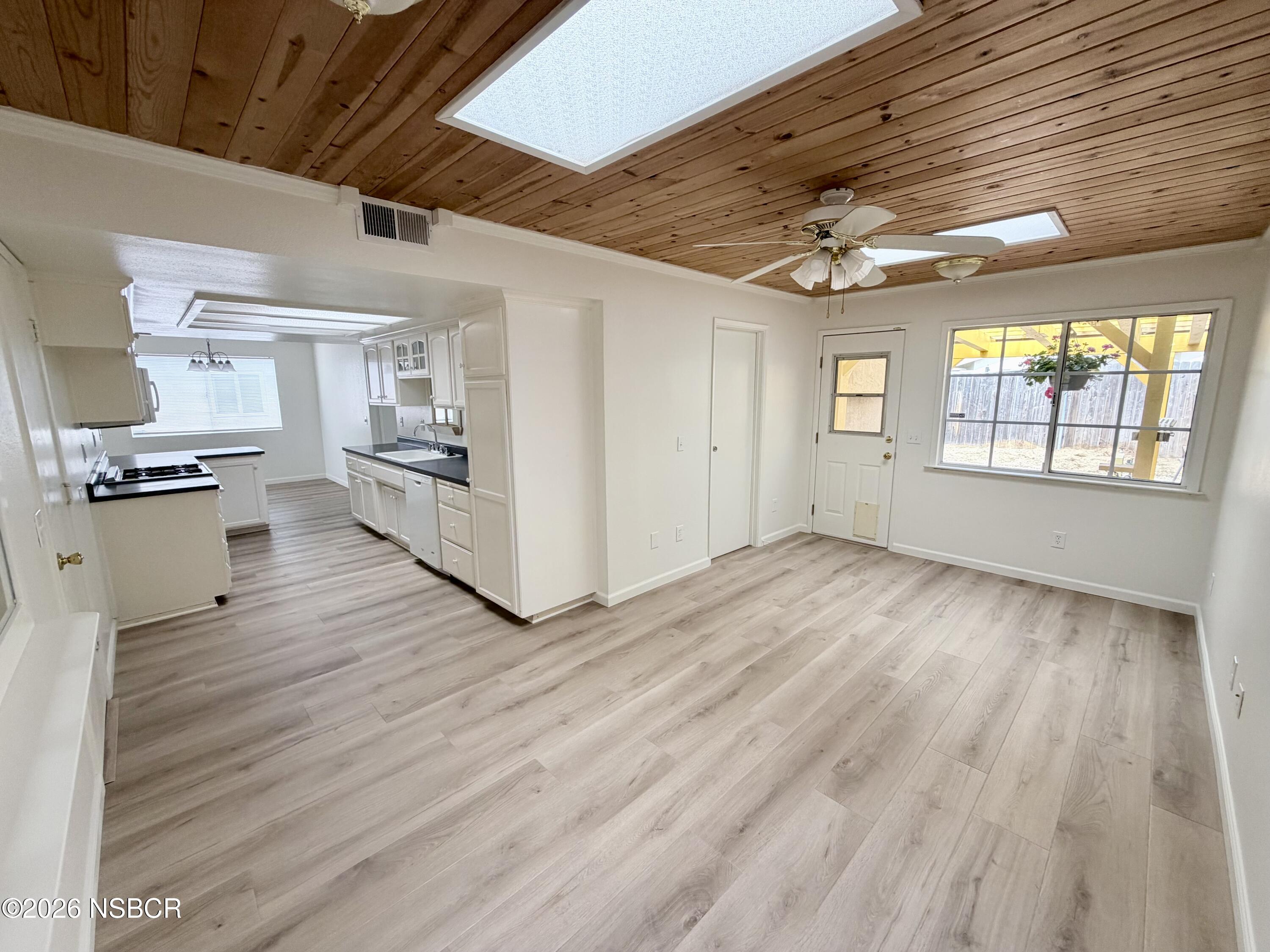 181 Janet Avenue Grover Beach, CA 93433 - Photo 10 of 21 a view of a kitchen with wooden floor