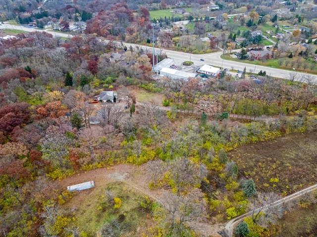 a view of a street with a yard