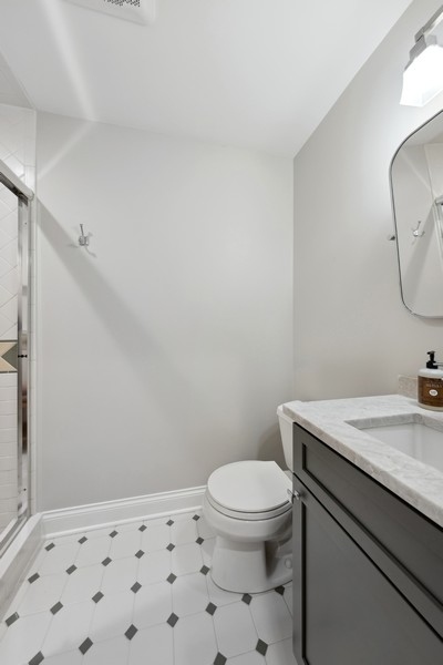 312 Forest Road Hinsdale, IL 60521 - Photo 39 of 49 a bathroom with a granite countertop toilet sink and mirror