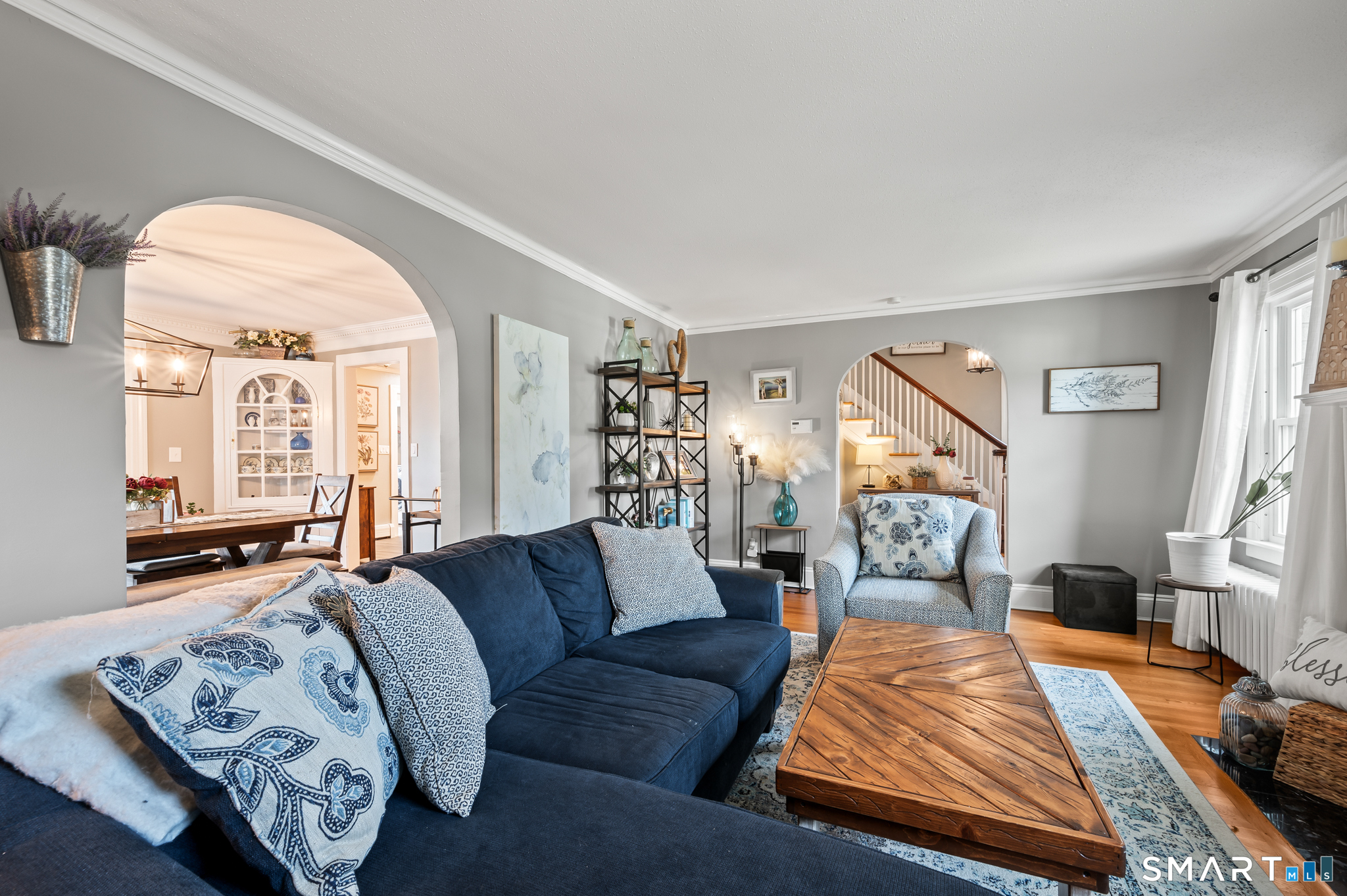 Beautiful archway transitioning into the formal dining room