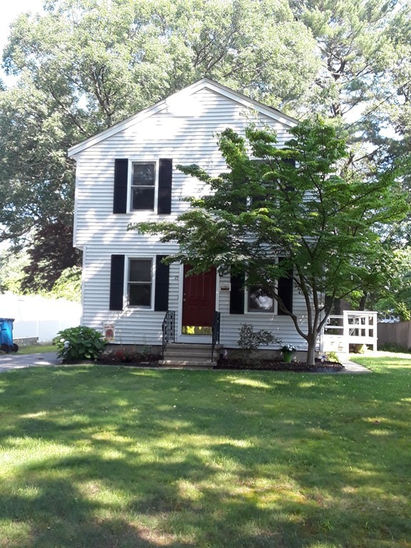 a view of a house with a yard porch and sitting area