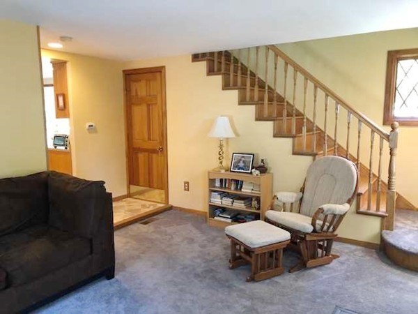 15 Primrose Road Billerica, MA 01821 - Photo 13 of 26 a living room with furniture and a chair