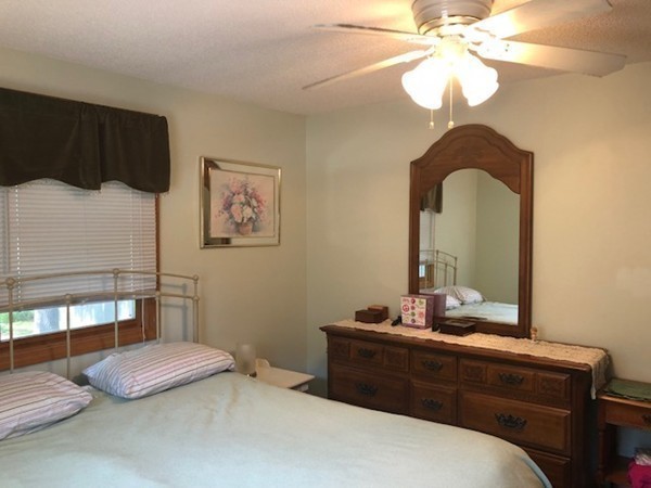 15 Primrose Road Billerica, MA 01821 - Photo 15 of 26 a bedroom with a bed and a mirror