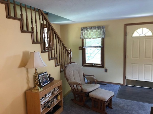 15 Primrose Road Billerica, MA 01821 - Photo 2 of 26 a living room with furniture and a window