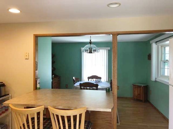 15 Primrose Road Billerica, MA 01821 - Photo 8 of 26 a view of a room that has a bed and a table in it