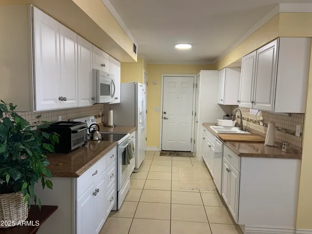 a view of a dining room with furniture and window