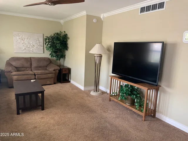 a kitchen with granite countertop a sink a stove and refrigerator