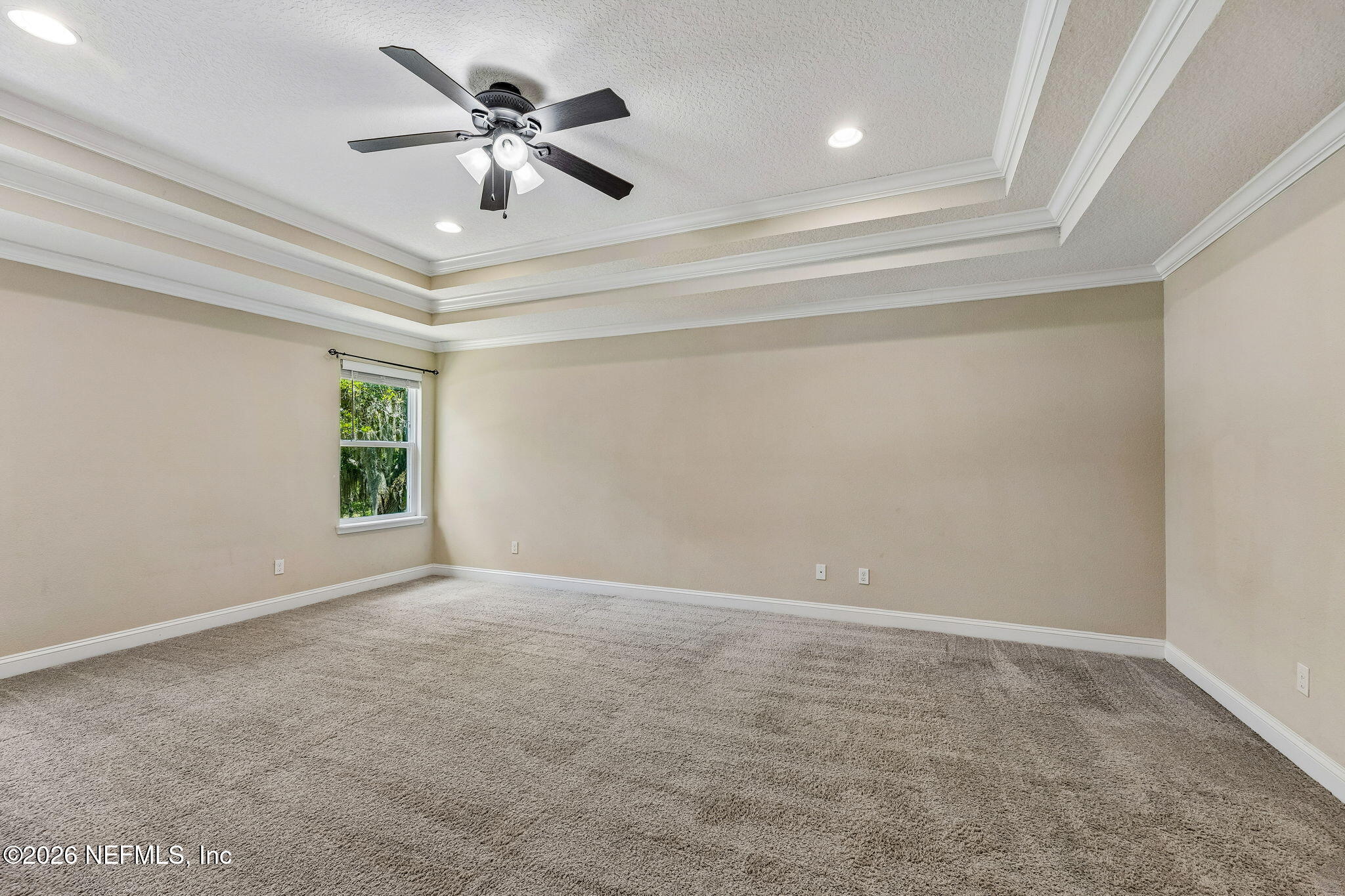 12198 Ridge Crossing Way Jacksonville, FL 32226 - Photo 25 of 67 a view of an empty room and a ceiling fan