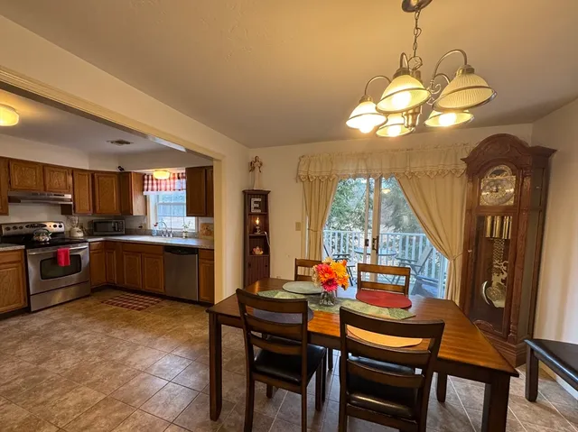 a kitchen with a table and chairs in it