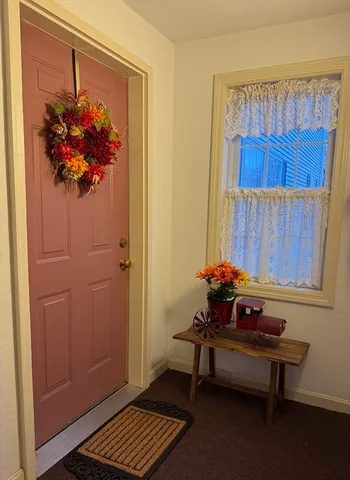 a sitting area with furniture and a window