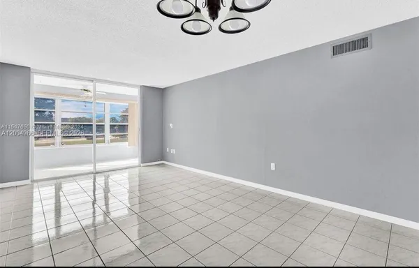 a view of an empty room and window