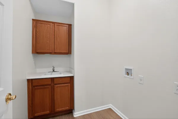 a view of cabinets and wooden floor