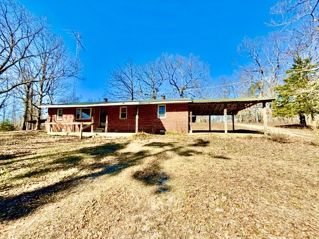 9554 Brooksie Thompson Road Bath Springs, TN 38311 - Photo 1 of 45 a front view of a house with a yard