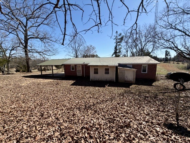 9554 Brooksie Thompson Road Bath Springs, TN 38311 - Photo 12 of 45 a front view of a house with a garden