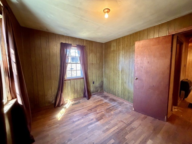 9554 Brooksie Thompson Road Bath Springs, TN 38311 - Photo 24 of 45 wooden floor in an empty room with a window