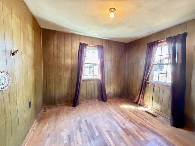 9554 Brooksie Thompson Road Bath Springs, TN 38311 - Photo 25 of 45 an empty room with wooden floor and windows