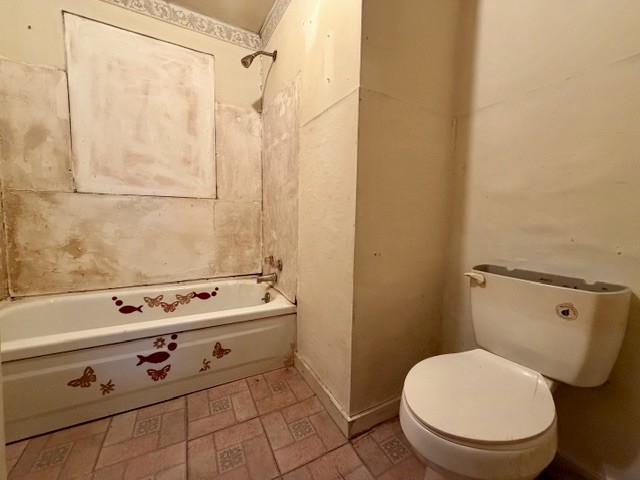 9554 Brooksie Thompson Road Bath Springs, TN 38311 - Photo 26 of 45 a bathroom with a toilet a sink and a shower